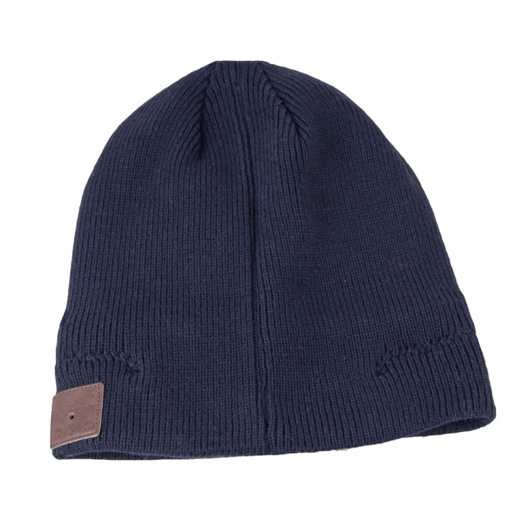 Navy blue knit beanie with brown control patch and ribbed fold cuff