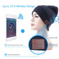 Navy blue knit beanie on a person’s head with brown control patch