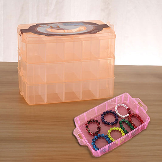 Three-layer plastic storage box with 36 slots, translucent orange with pink jewelry tray and beads