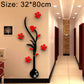 Black vase wall sticker with red flowers and branch design on corridor wall