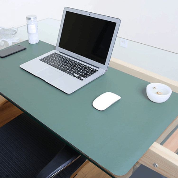 Oversized PU leather desk mat in muted green with rounded corners