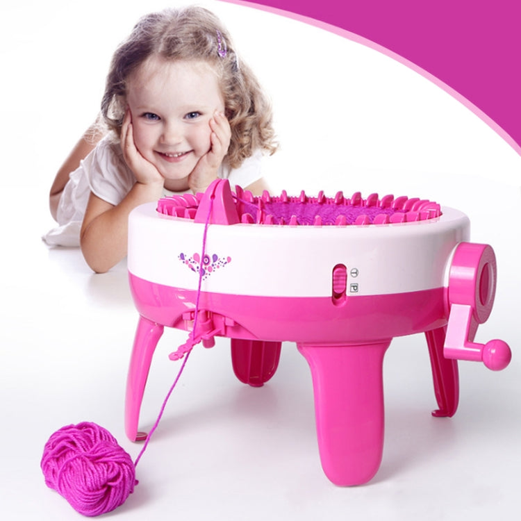 Pink kids knitting machine toy with yarn strand and colorful bobbins