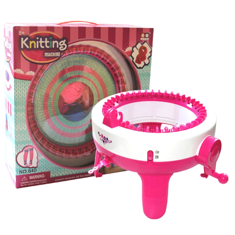 Pink kids knitting machine toy shown with retail package and circular knitting ring