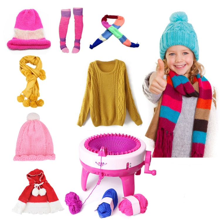 Kids knitting machine toy with finished knit items and yarn balls
