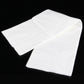 Two folded white disposable cotton bath towels