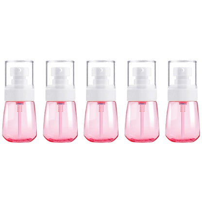 Set of 5 leak-proof 30ml travel plastic bottles with pink translucent bodies and white sprayer pumps