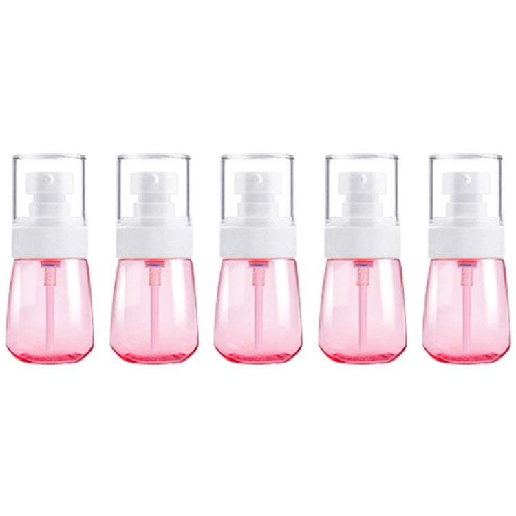 Five-pack of 30ml leak-proof travel plastic bottles with pink translucent bottles and white pump sprayers