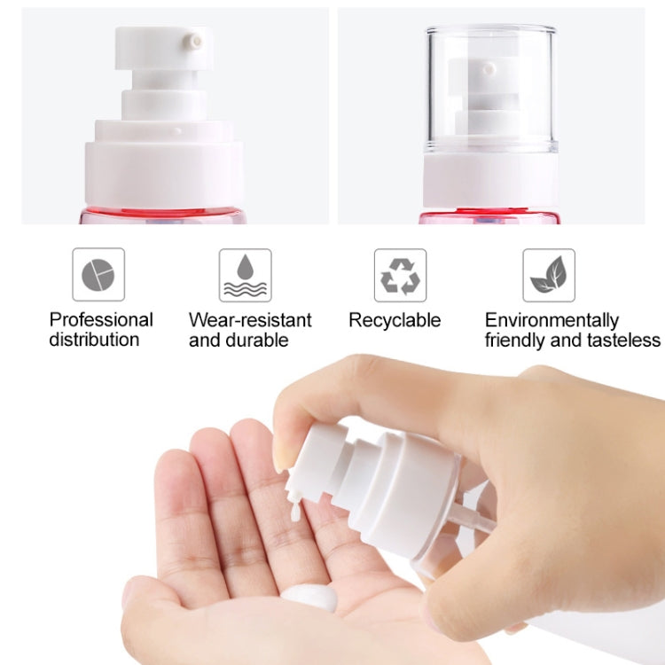 White pump sprayer tops with red ring on translucent bottles; hand pressing the nozzle