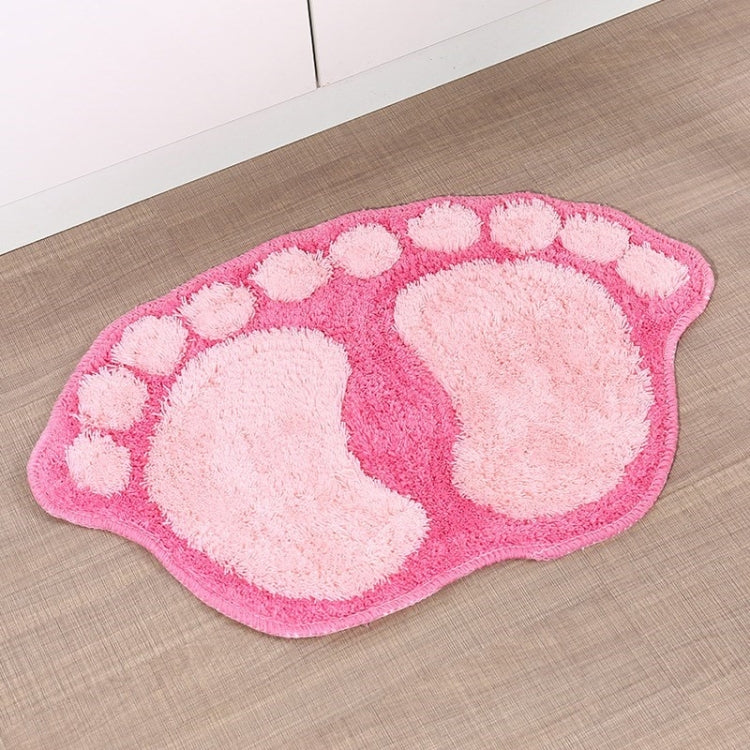 Pink foot-shaped shaggy rug mat with white paw-print pattern
