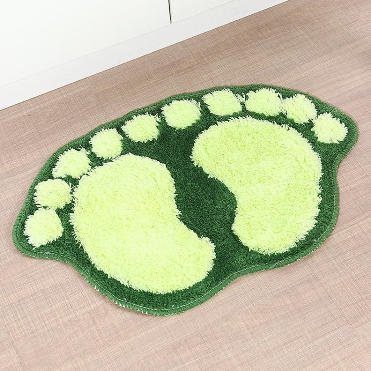 Green foot-shaped shaggy rug mat with white and light-green paw pattern