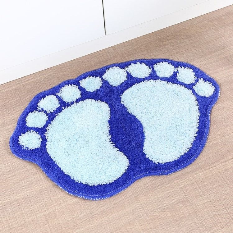 Blue foot-shaped shaggy rug mat with white paw-print pattern