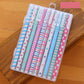 Clear case holding colorful 0.5mm gel pens with floral, polka-dot, and striped designs