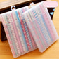 Clear pen case with multiple 0.5mm gel pens, striped and dotted floral patterns