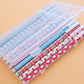 Pack of 0.5mm gel pens in clear box with stripes, dots, and heart motifs