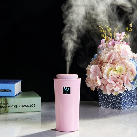 Pink small humidifier with LED night light, top control, and visible mist output
