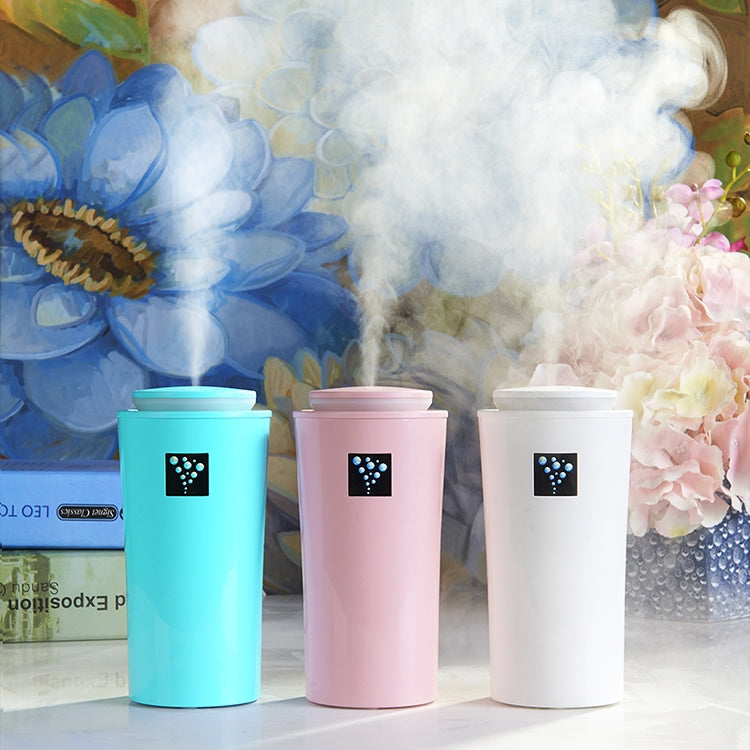 Set of three humidifiers in blue, pink, and white with LED panels and mist