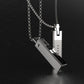 Silver-tone magnetic pendant necklace with layered black-and-white bar design
