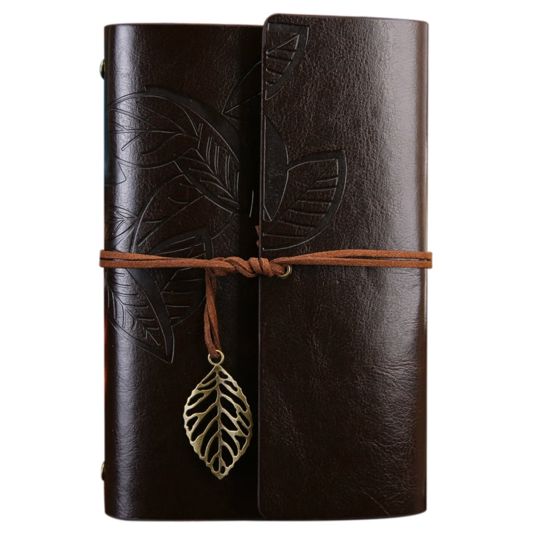 Leather-look travel diary notebook in dark brown with leaf embossed cover and hanging leaf charm