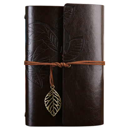 Leather-look travel diary notebook in dark brown with leaf embossed cover and hanging leaf charm
