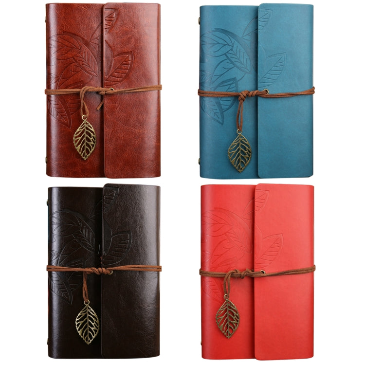 Set of leaf-embossed travel diary notebooks in brown, blue, and red with hanging leaf charms