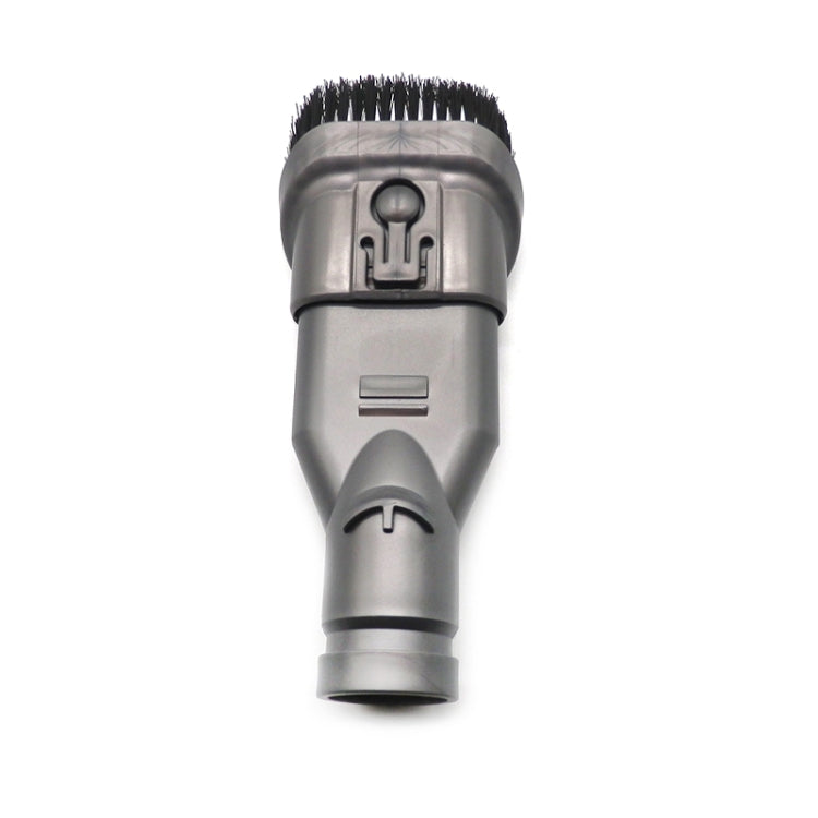 Gray vacuum brush head with black bristle rows and central intake opening