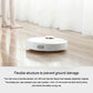 White robotic vacuum sweeping on floor with top status light
