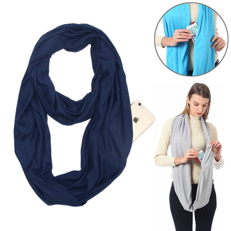 Navy blue infinity scarf with zip pocket loop, shown on model