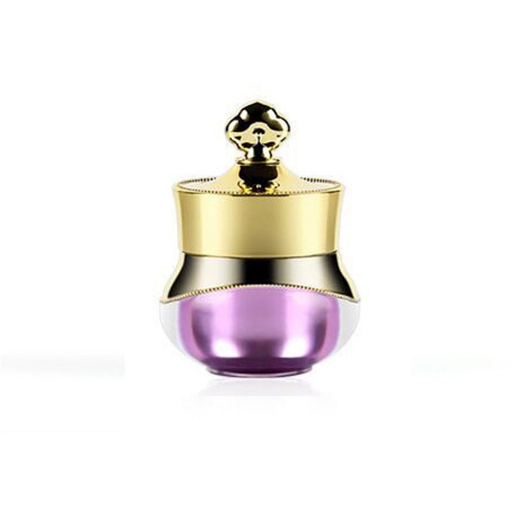 Gold travel container with purple acrylic base and hard sealed lid