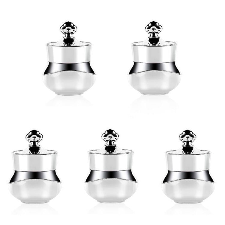 Set of silver travel containers with clear bodies and hard sealed lids