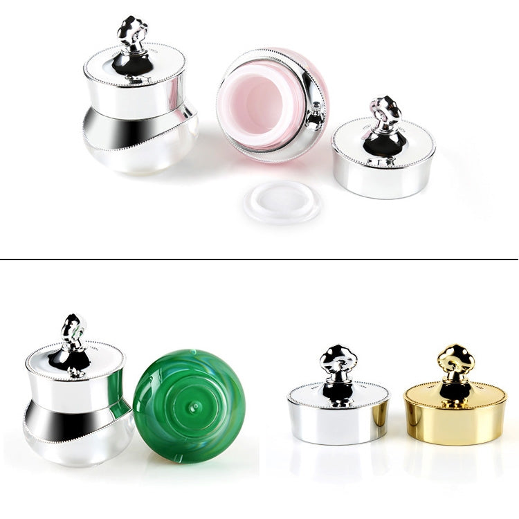 Assorted travel containers with hard sealed lids in silver, pink, green, and gold