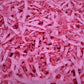 Pink shredded paper filler strips, crumpled crinkle paper confetti