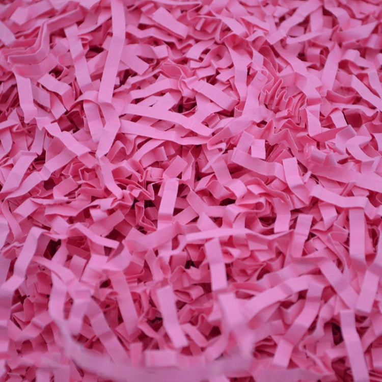 Pink shredded paper filler strips, crumpled crinkle paper confetti