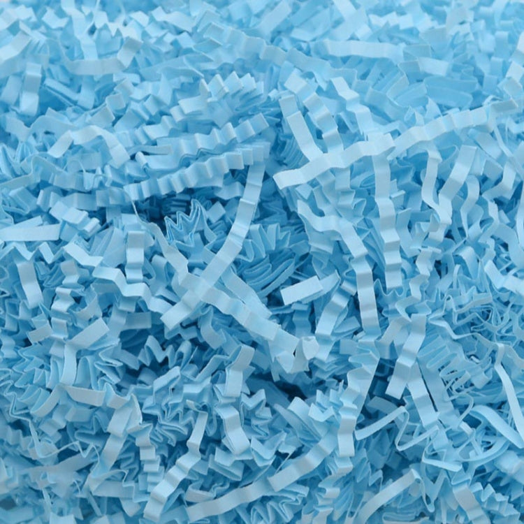 Light blue shredded paper filler strips, crumpled crinkle paper pieces
