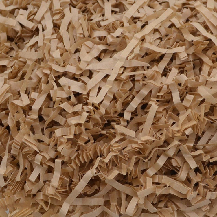 Tan shredded paper filler strips, crumpled crinkle paper confetti