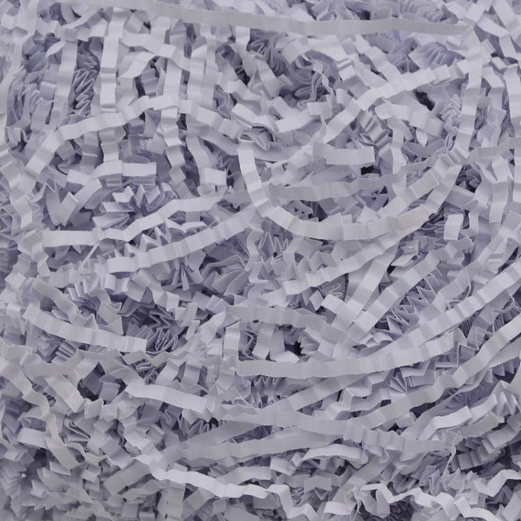 Pale lilac shredded paper filler strips, crumpled and densely packed