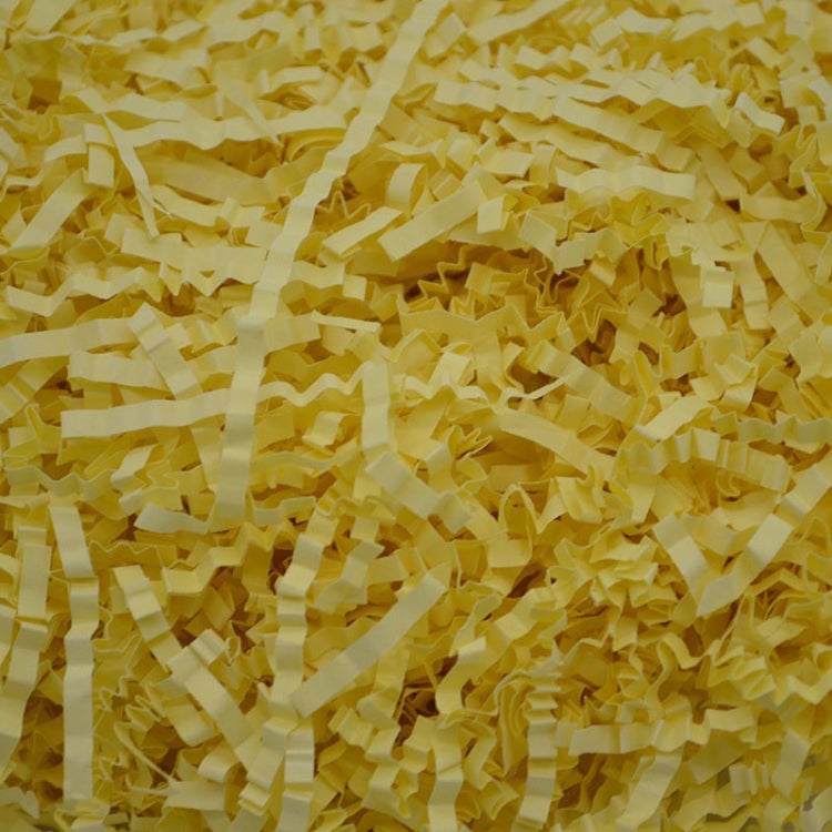 Shredded raffia paper filler, pale yellow crumpled strands