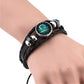 Black braided leather bracelet with round teal constellation charm, fish-shaped glyph, silver clasp