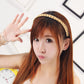 Light yellow braided twist hair headband on long hair