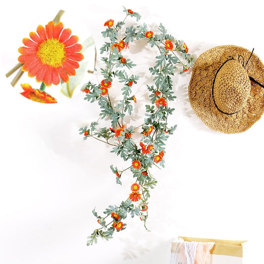 Artificial flower vine with orange daisy blossoms and green leafy sprigs, 1.75m length