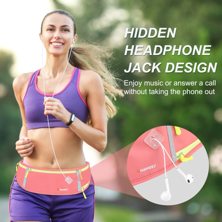 Pink running belt waist pack with hidden headphone jack design and earphone cord access.