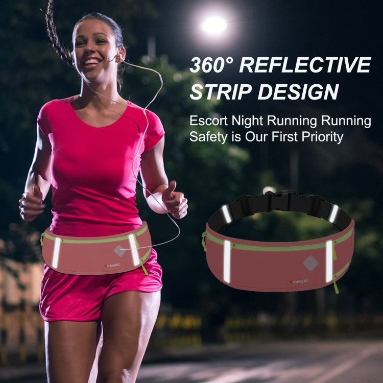 Pink running belt waist pack with 360 reflective strip design, worn on a runner.