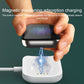 White magnetic charging base holding a watch on the round contact pad