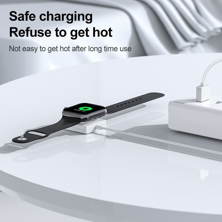 Smartwatch resting on white magnetic charging base with USB power cable