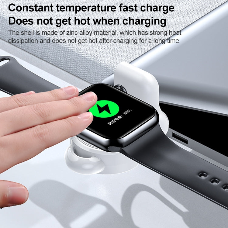 Black Apple Watch magnetic charger base adjusted by hand on a strap