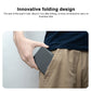 Gray foldable wireless charger tucked into fabric case, held by hand