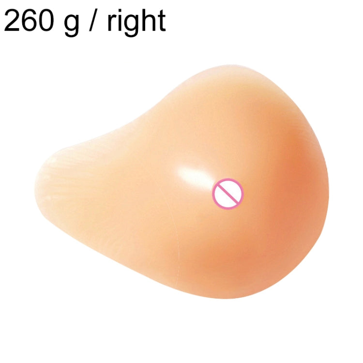 Right silicone breast pad, smooth peach teardrop shape with nipple detail