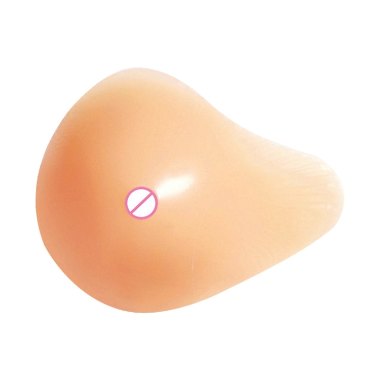 Light peach spiral-shape silicone breast pad for left side, smooth rounded surface