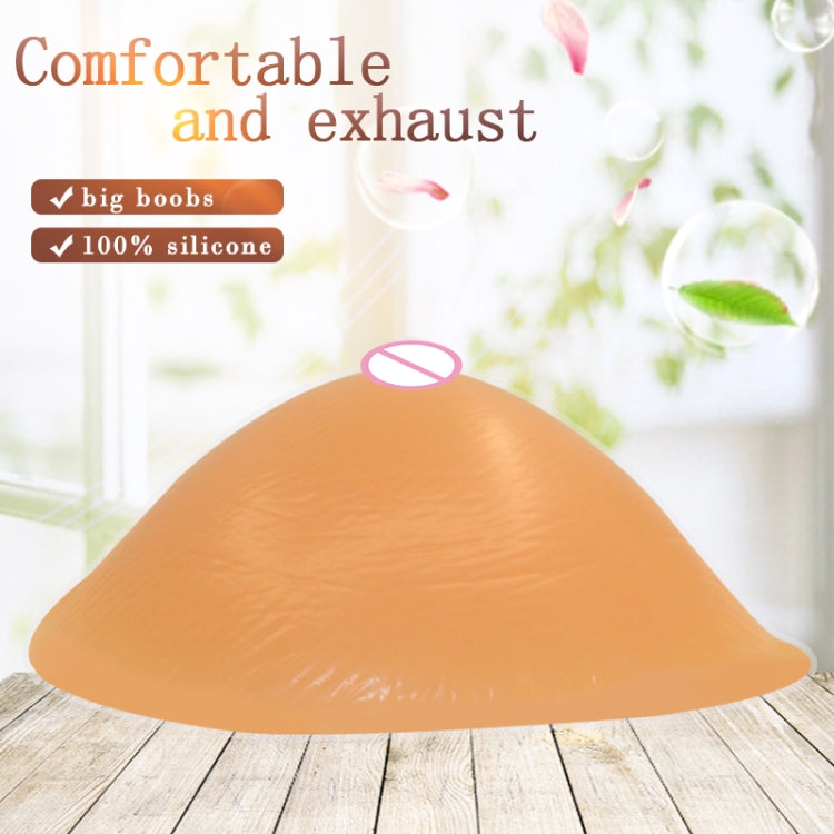 Light peach spiral-shape silicone breast pad, curved cup form for breast coverage