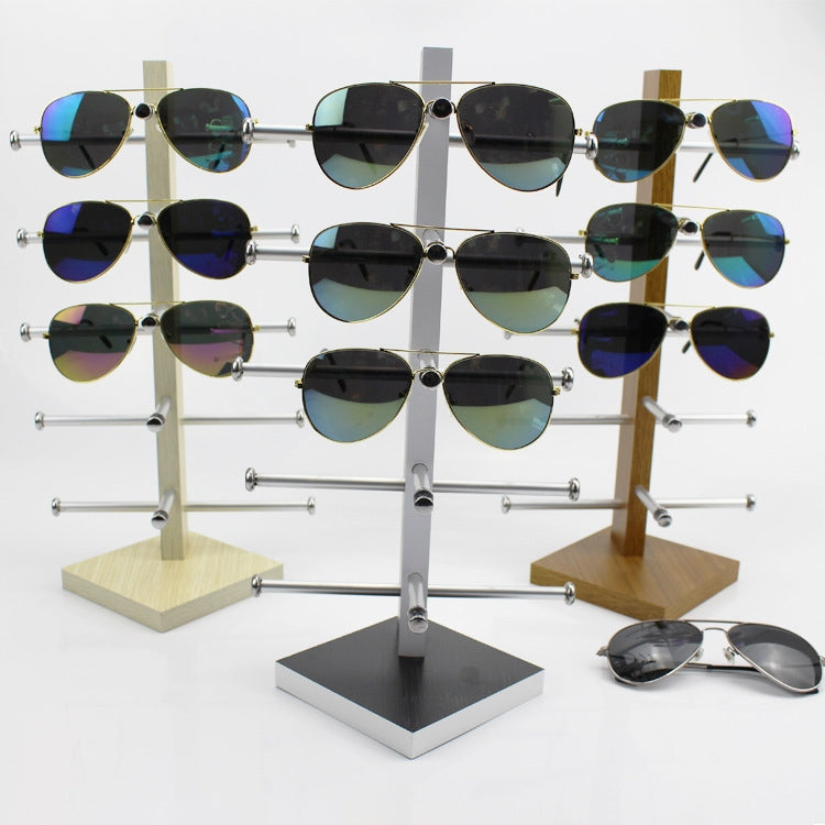 Oak wood sunglasses display rack with clear glass frame, holds multiple pairs on bars