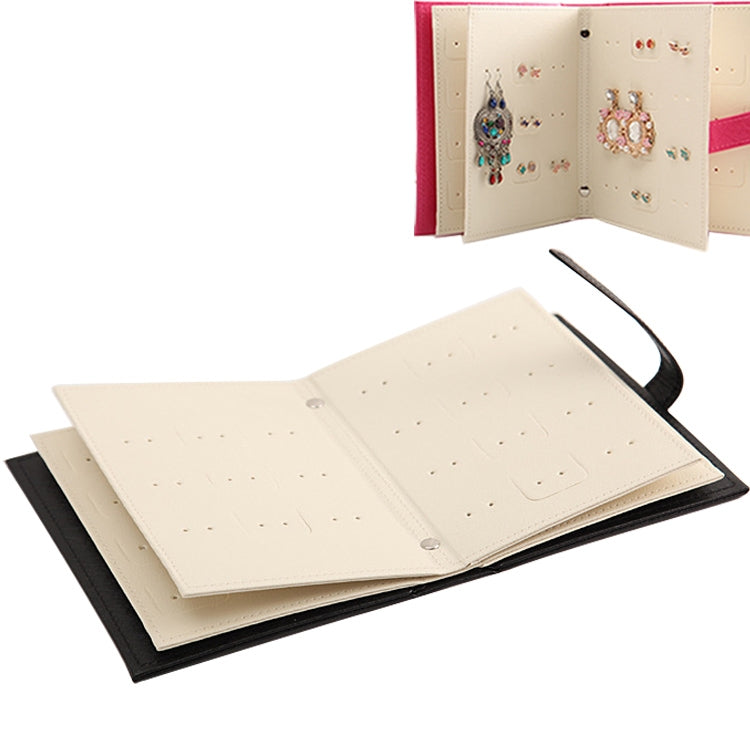 Book-shaped jewelry display rack with cream pages and earring holder insert
